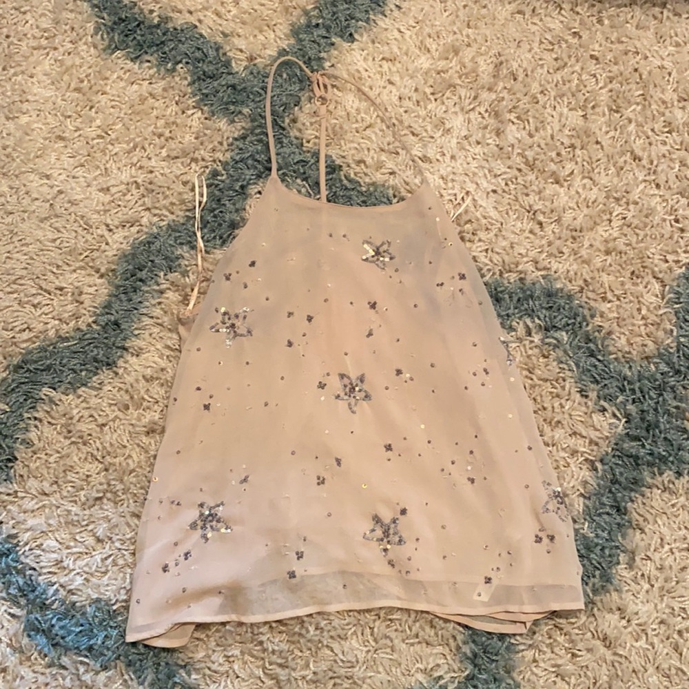 Light pink tank with sequin star detailing. Size small. Free People Intimately
